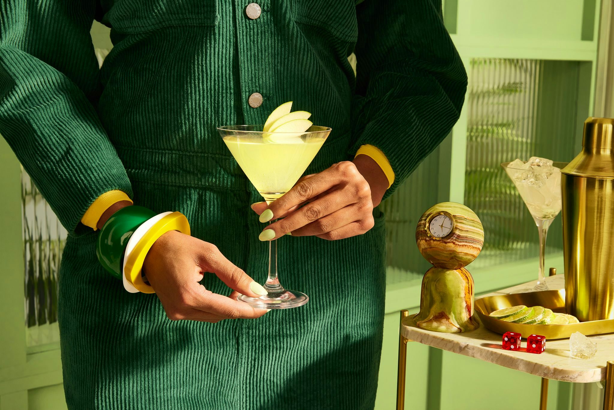 A photo of a person holding a cocktail.
